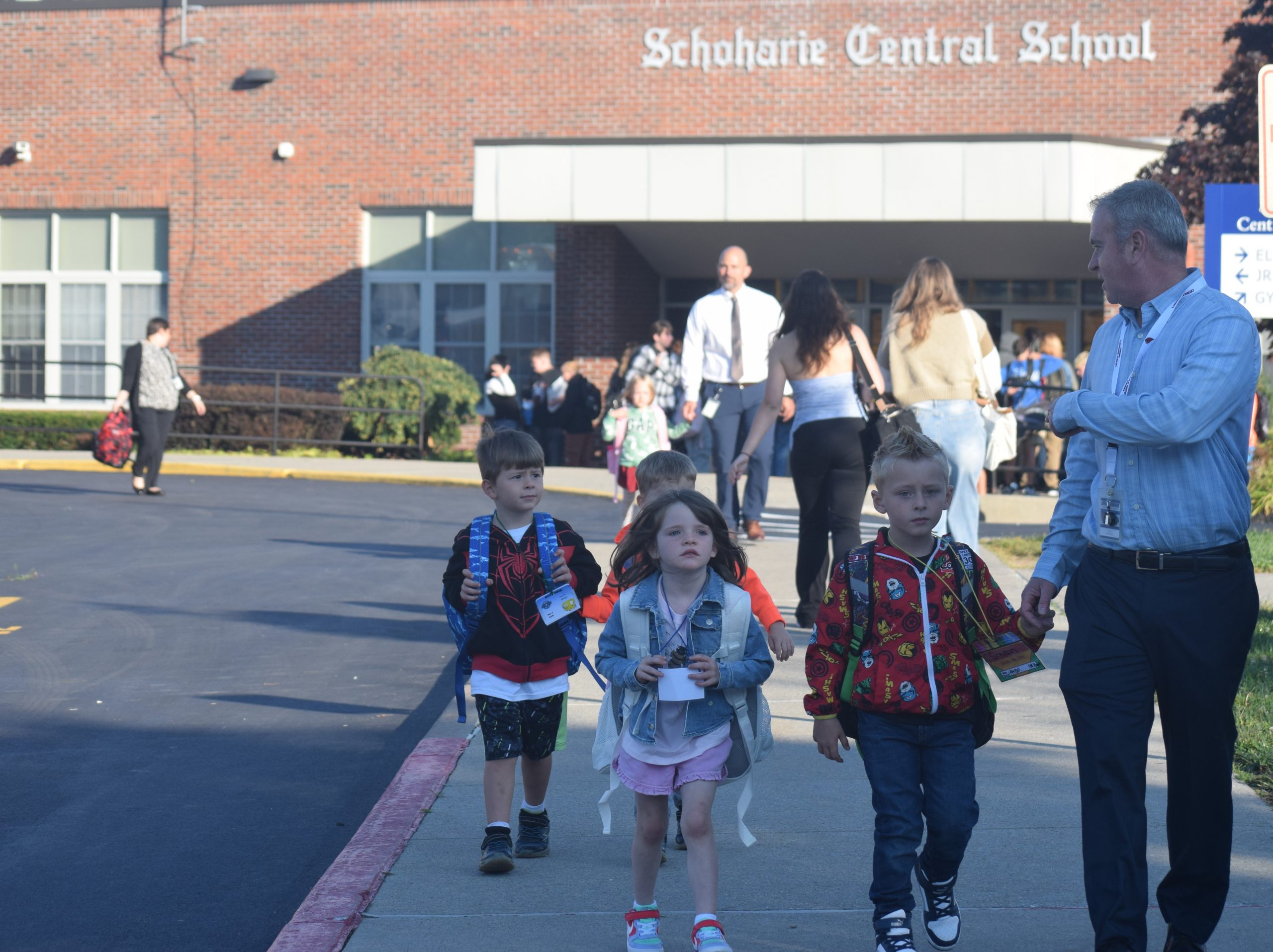 superintendent walks students to class