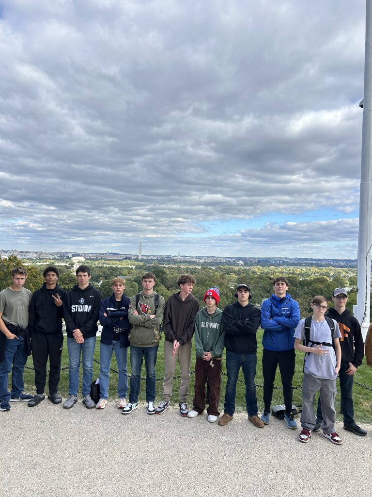 Students stand in front of a panoramic view