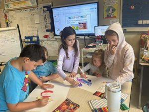 students work at a table