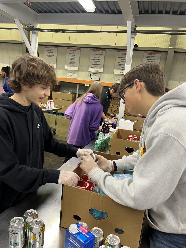 Students pack a box