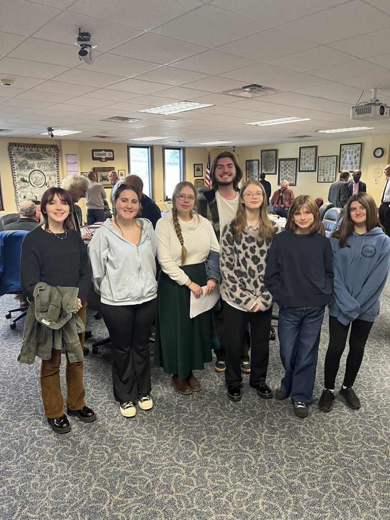 A group of students stand