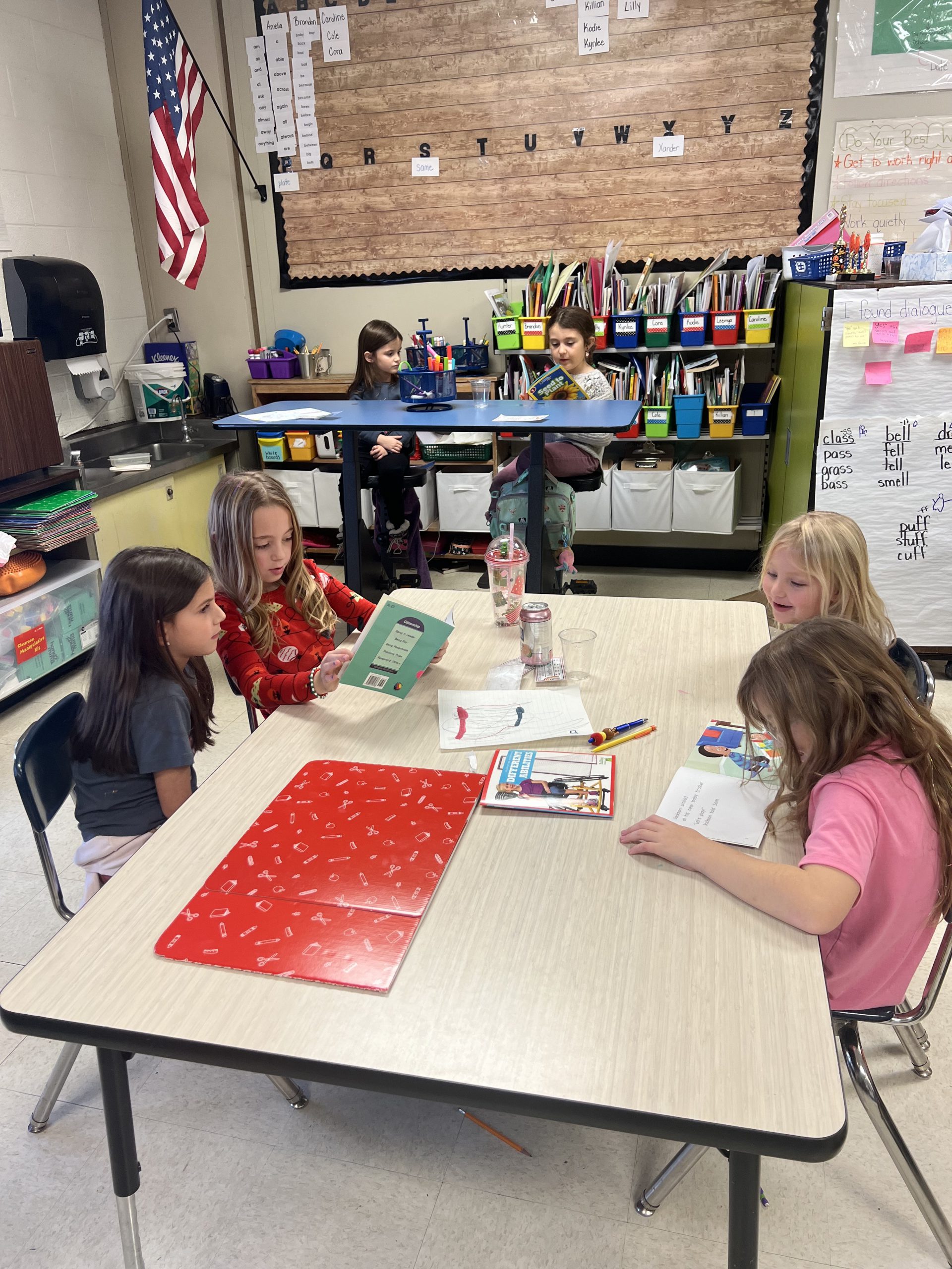 student reads at a table