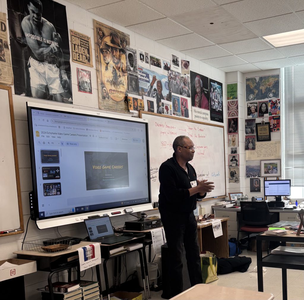 A man speaks to a class