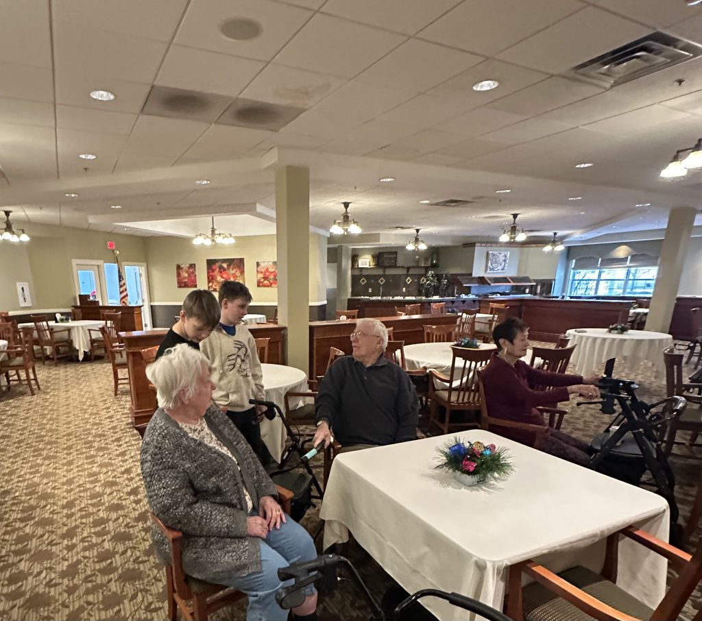 students mingle with their senior friends